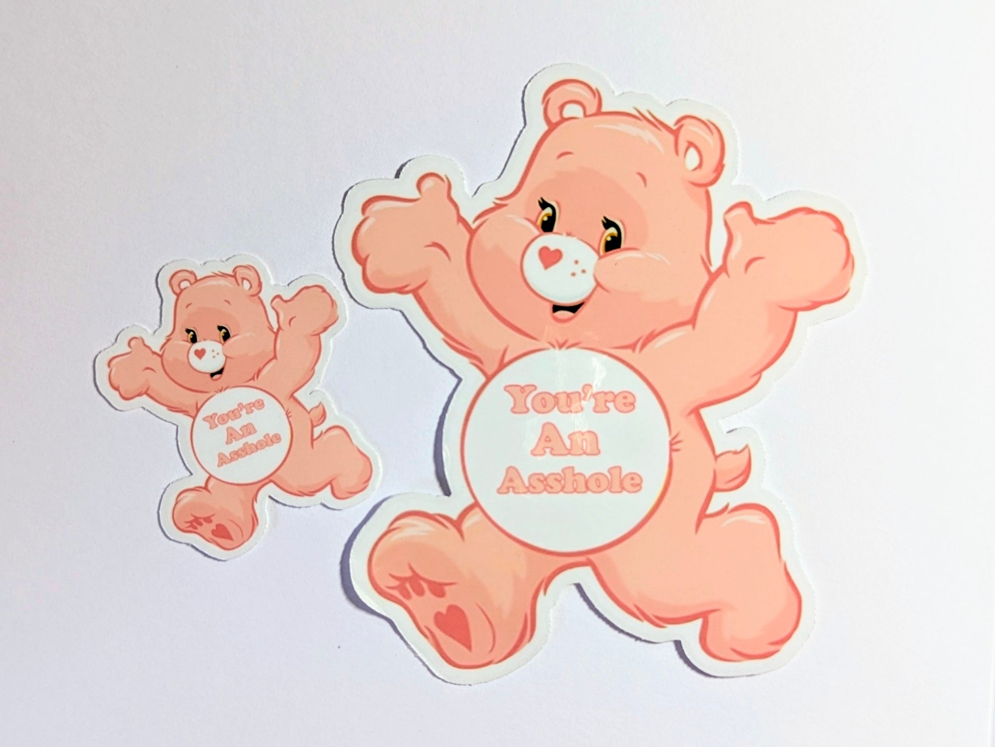 Two cartoon bears with humorous text on a light gray background