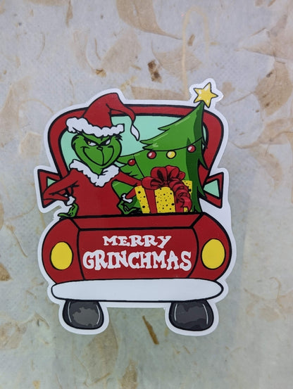 Sticker of a character from a Christmas movie on a textured beige background