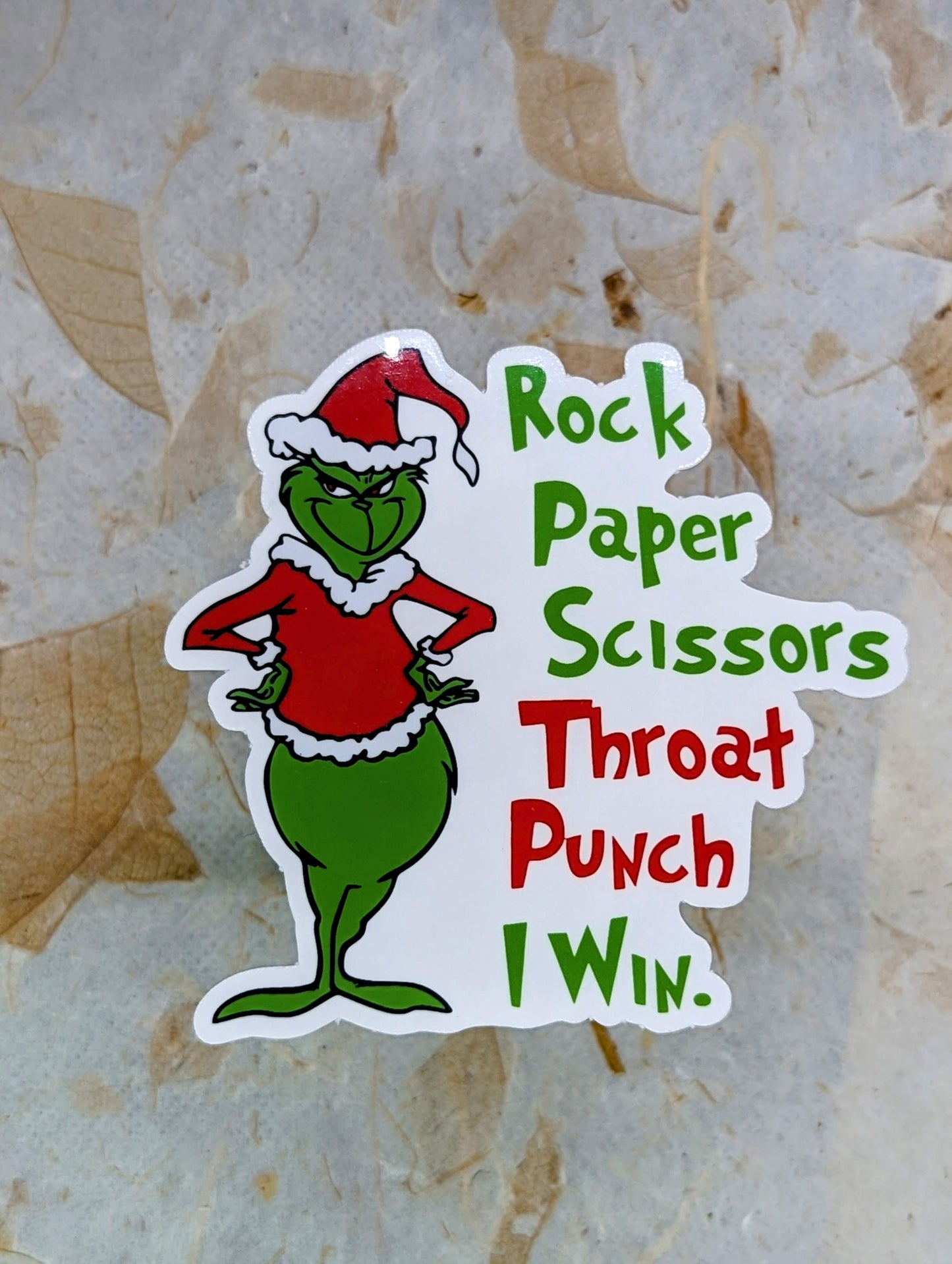 Sticker with  Grinch in a Santa hat  