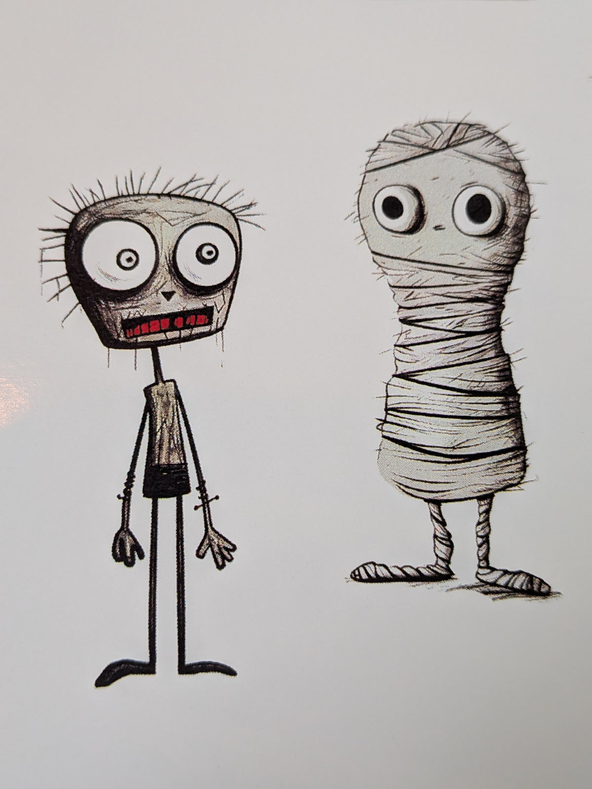 Close-up of sketched zombie and mummy Halloween stickers