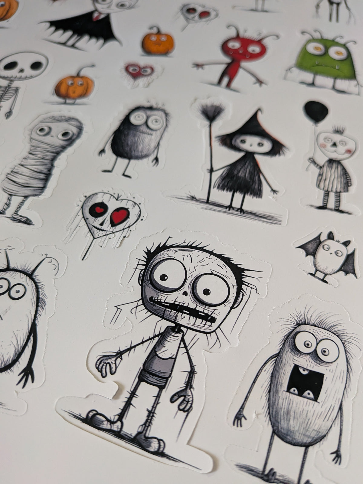 Sketched Halloween stickers with a zombie boy, mummy, witch and fuzzy monster