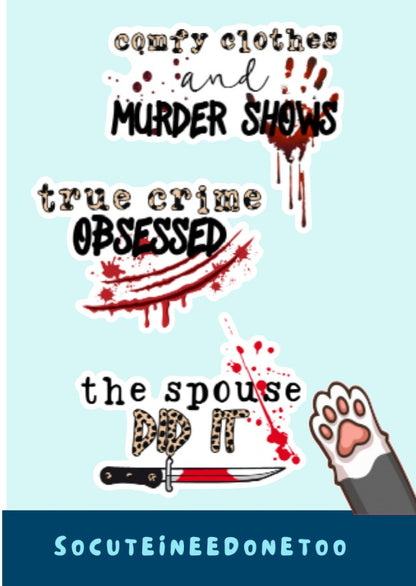 A glossy white sticker with text and graphics related to true crime themes, such as 'true crime obsessed', 'the spouse', and 'murder shows'. A paw print holds a knife, adding a playful yet thematic touch to the design.