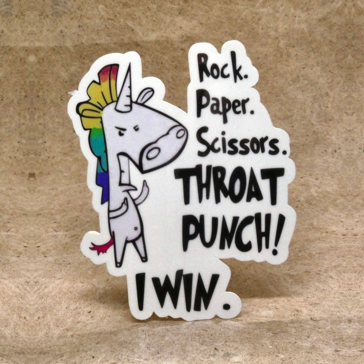 Rock Paper Scissors Throat Punch unicorn die-cut vinyl sticker, real product photo