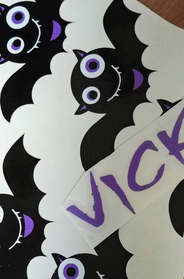 Cute black and purple bat vinyl decals with a custom name