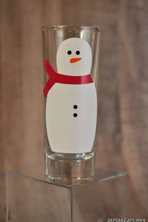 Snowman with red scarf vinyl decal on a shot glass