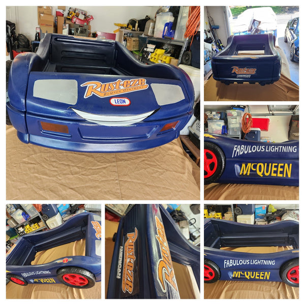 Custom race car toddler bed decked out with vinyl decals, a personal project