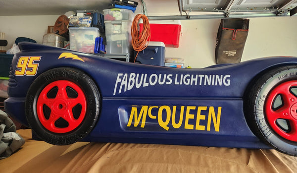 Side of a custom race car bed with number and name vinyl decals, a personal project