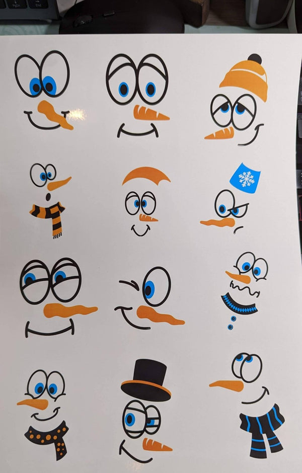 Sheet of twelve fun snowman face waterslide decals with carrot noses and scarves