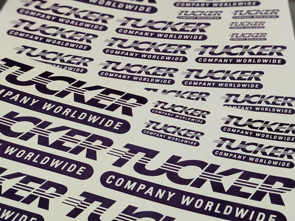 Custom purple company logo waterslide decals in multiple sizes
