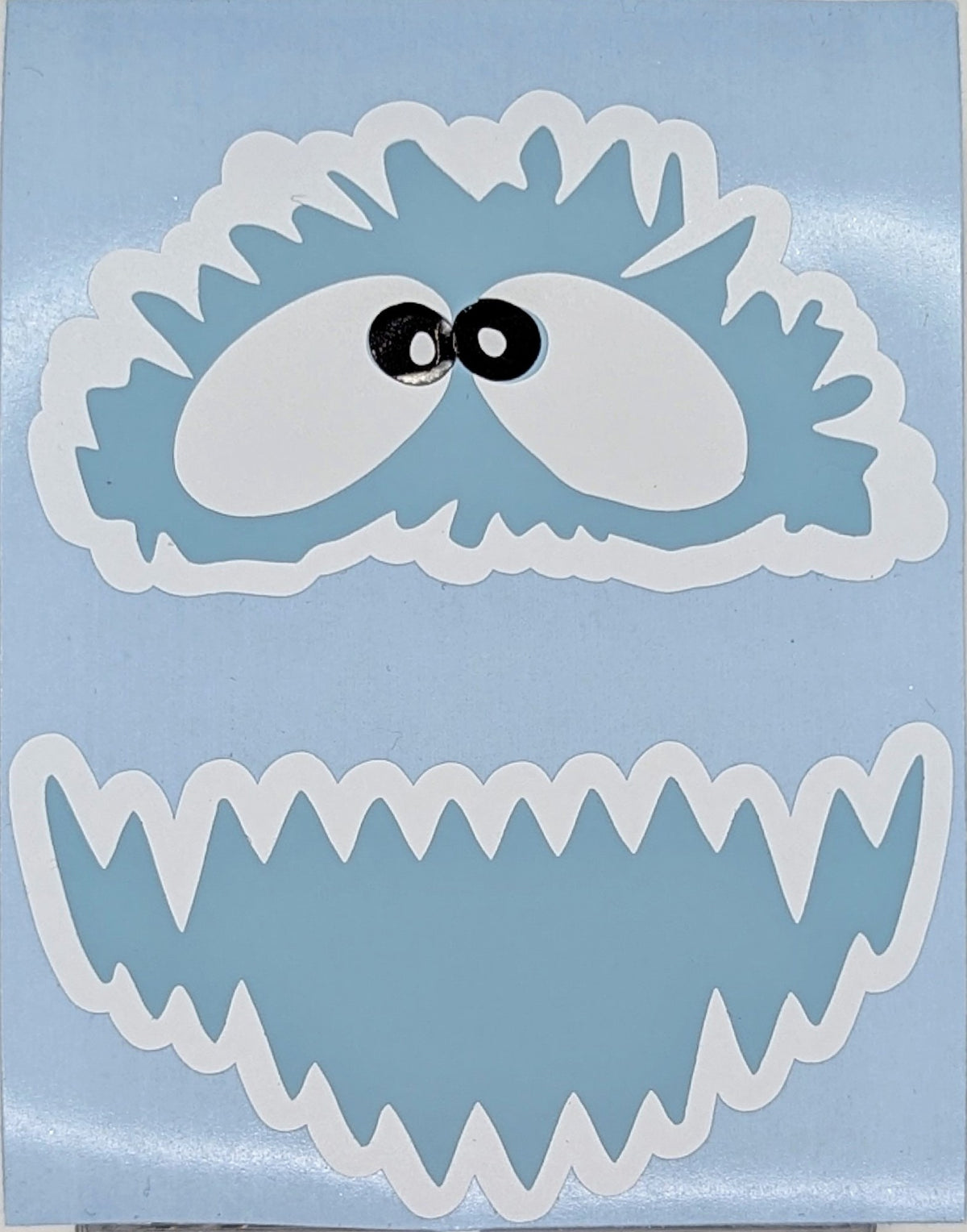 Close-up of the layered yeti face vinyl decal with googly eyes and icy teeth